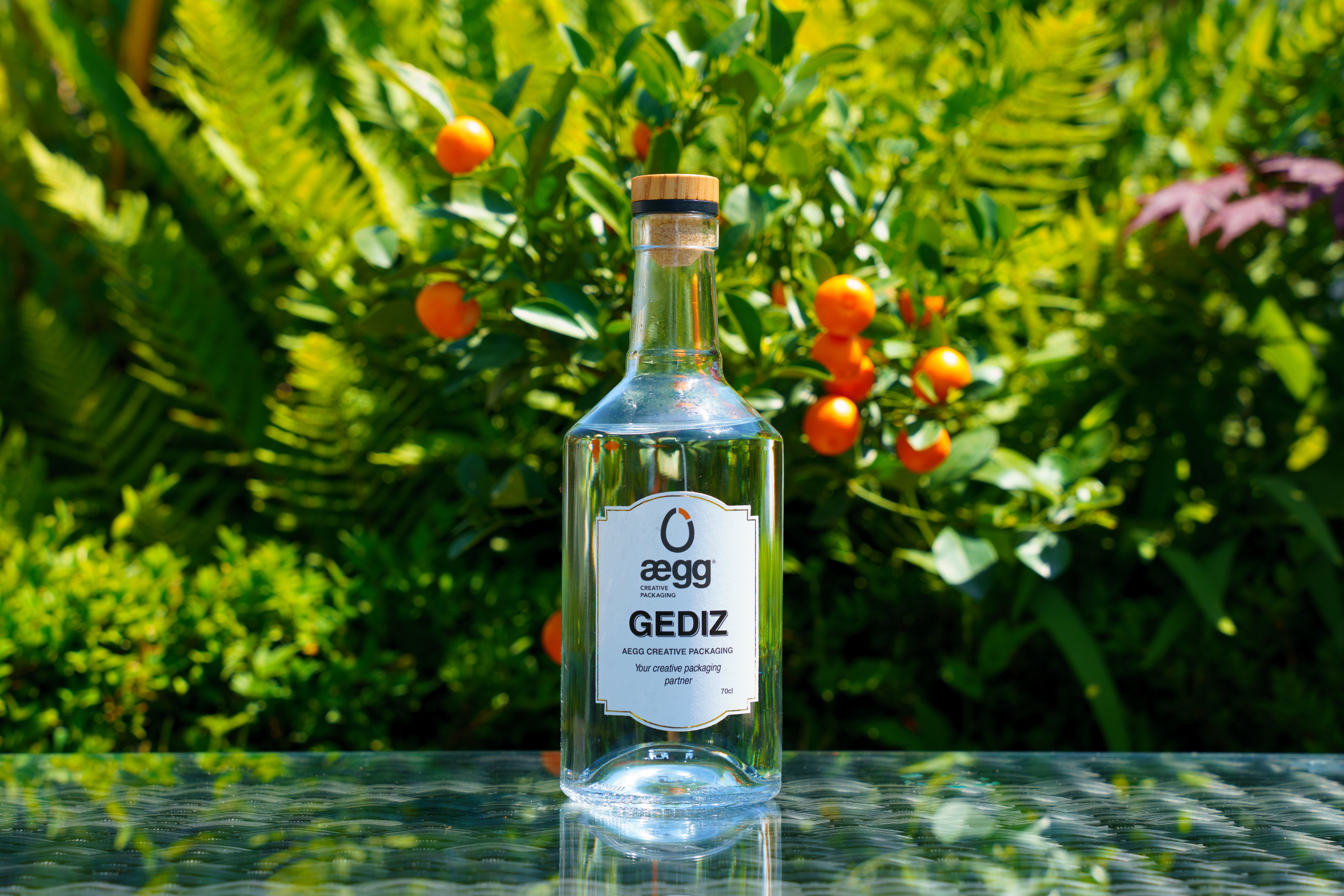 Aegg's Gediz spirit bottle pictured in a sunny garden